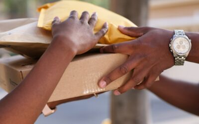 Person handing three packages to another person